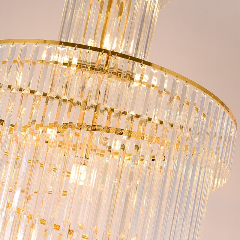 Close-up of diamond-cut crystal prisms on the VORELLI® Manhattan spiral staircase chandelier reflecting luxury light