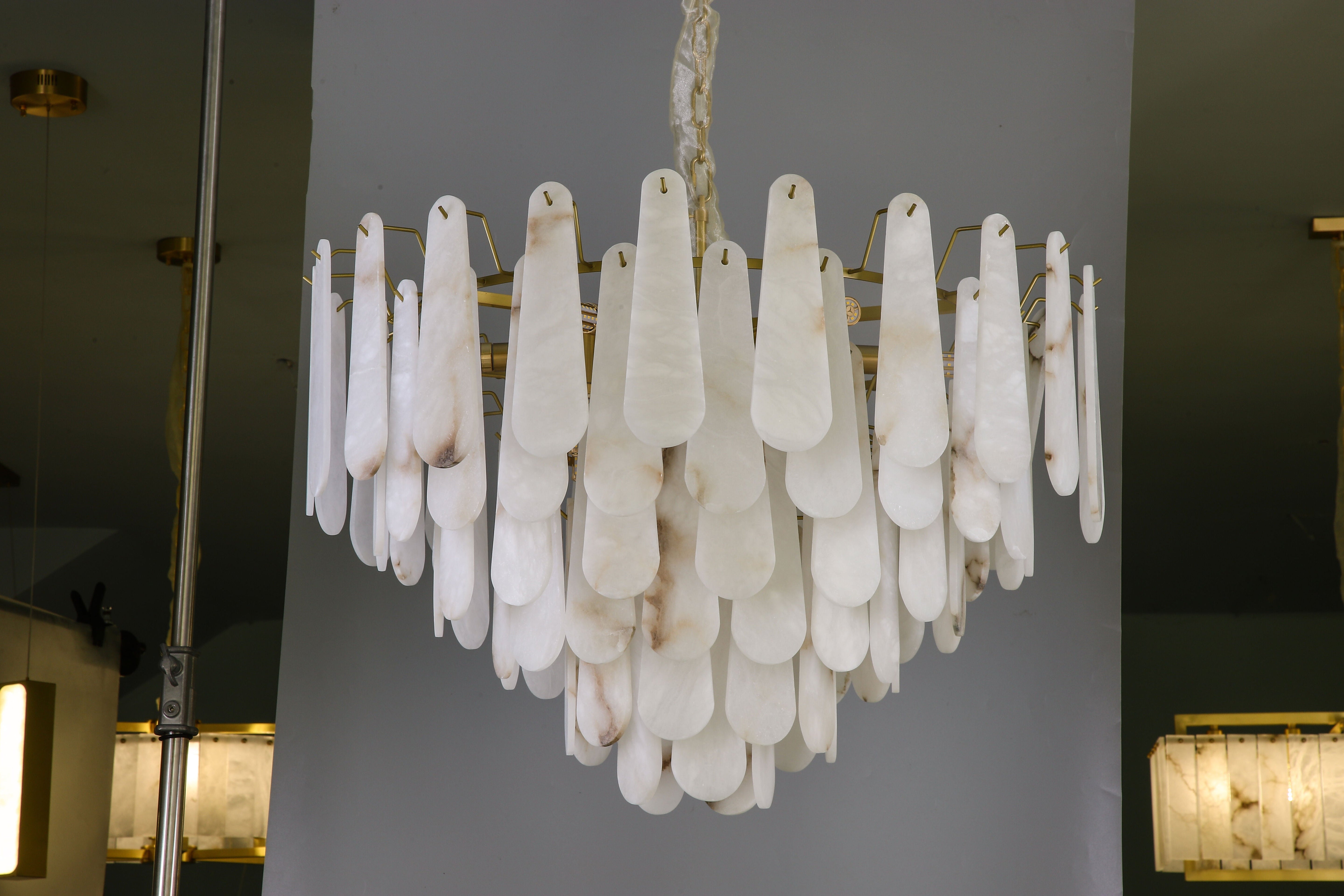 VORELLI Maretto marble circular chandelier suspended in a luxury interior creating an elegant focal point