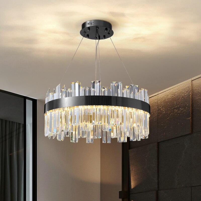 VORELLI Medina circular chandelier with crystal bars and stainless steel frame creating a glowing ring of luxury light in a modern interior