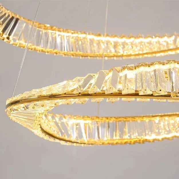 Detailed close-up of twisted crystal bars forming the dual circular structure of the VORELLI Melia chandelier