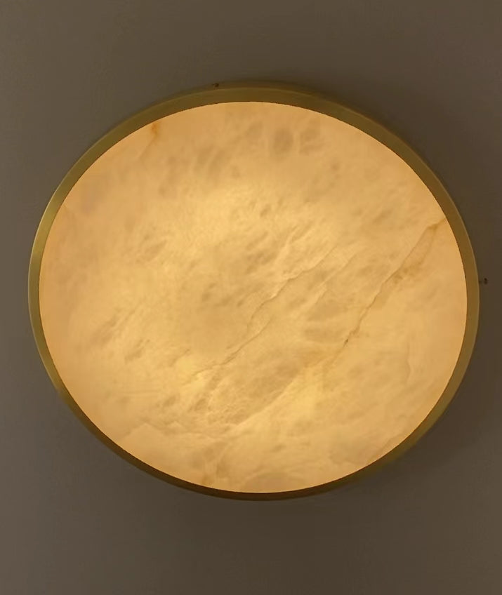 Detailed view of natural marble surface on VORELLI® Morenita luxury circular ceiling light