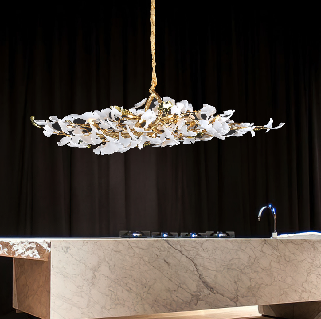 Prano Rectangular Chandelier II by VORELLI® suspended above a luxury dining table with sculptural white glass petals