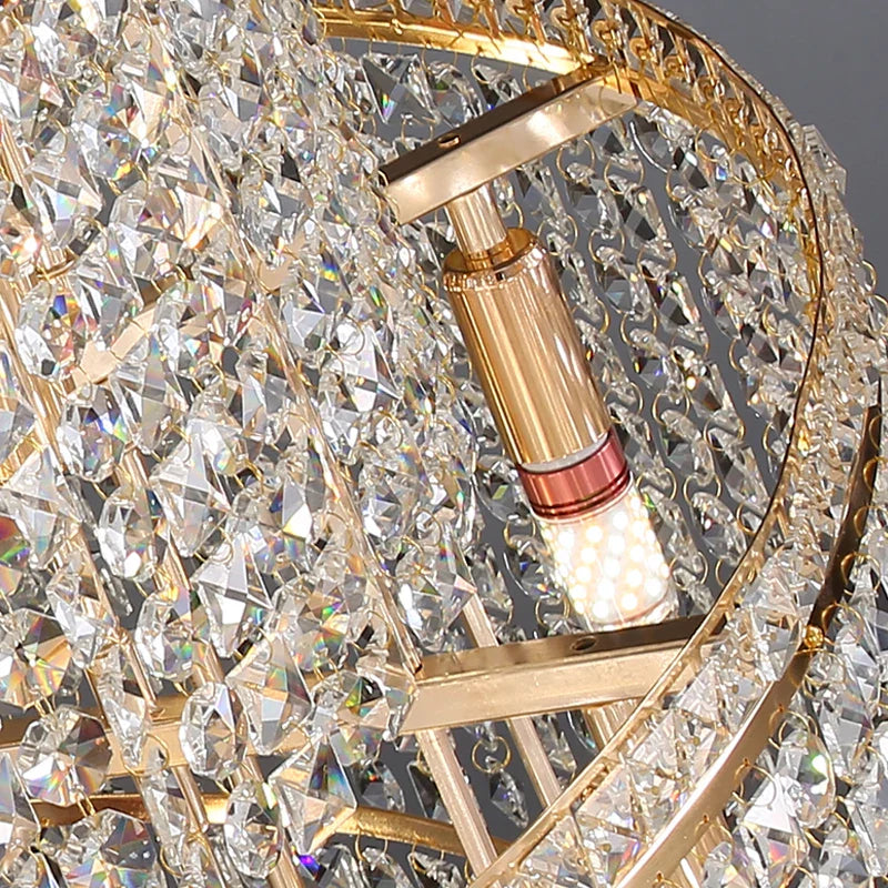Long cascading staircase lighting by VORELLI® with sparkling crystal tiers enhancing grand entrance halls and high ceilings