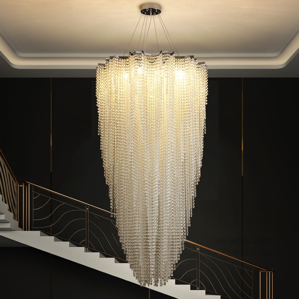 Grand foyer chandelier by VORELLI® with shimmering cascading crystals enhancing luxury homes, hotels, and architectural staircases