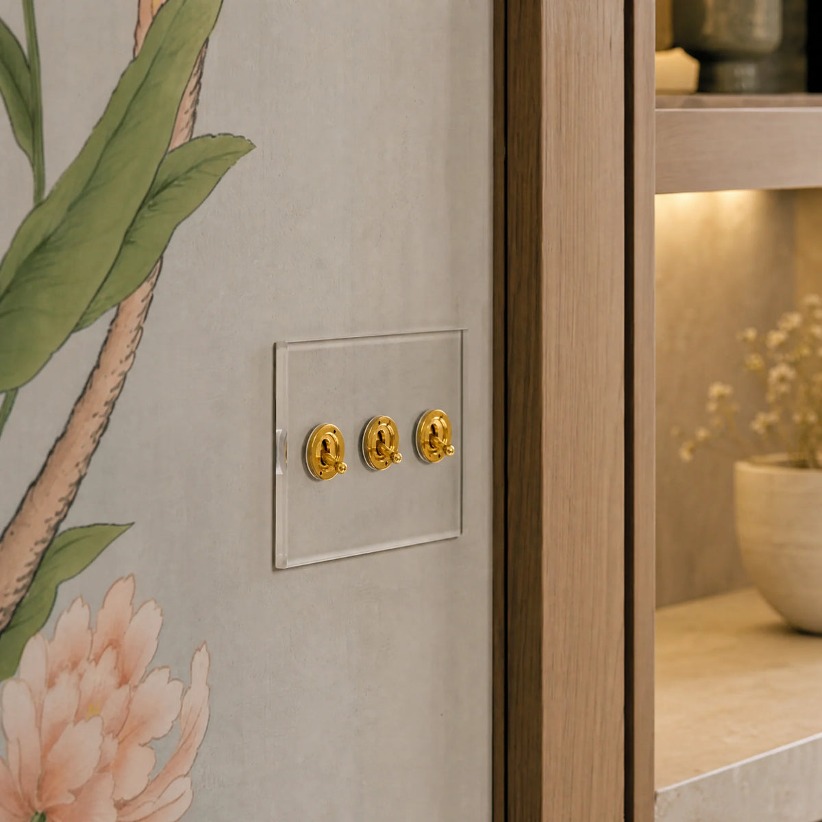 VORELLI® Prism three-gang toggle switch, close view on an interior wall in an interior visualisation.