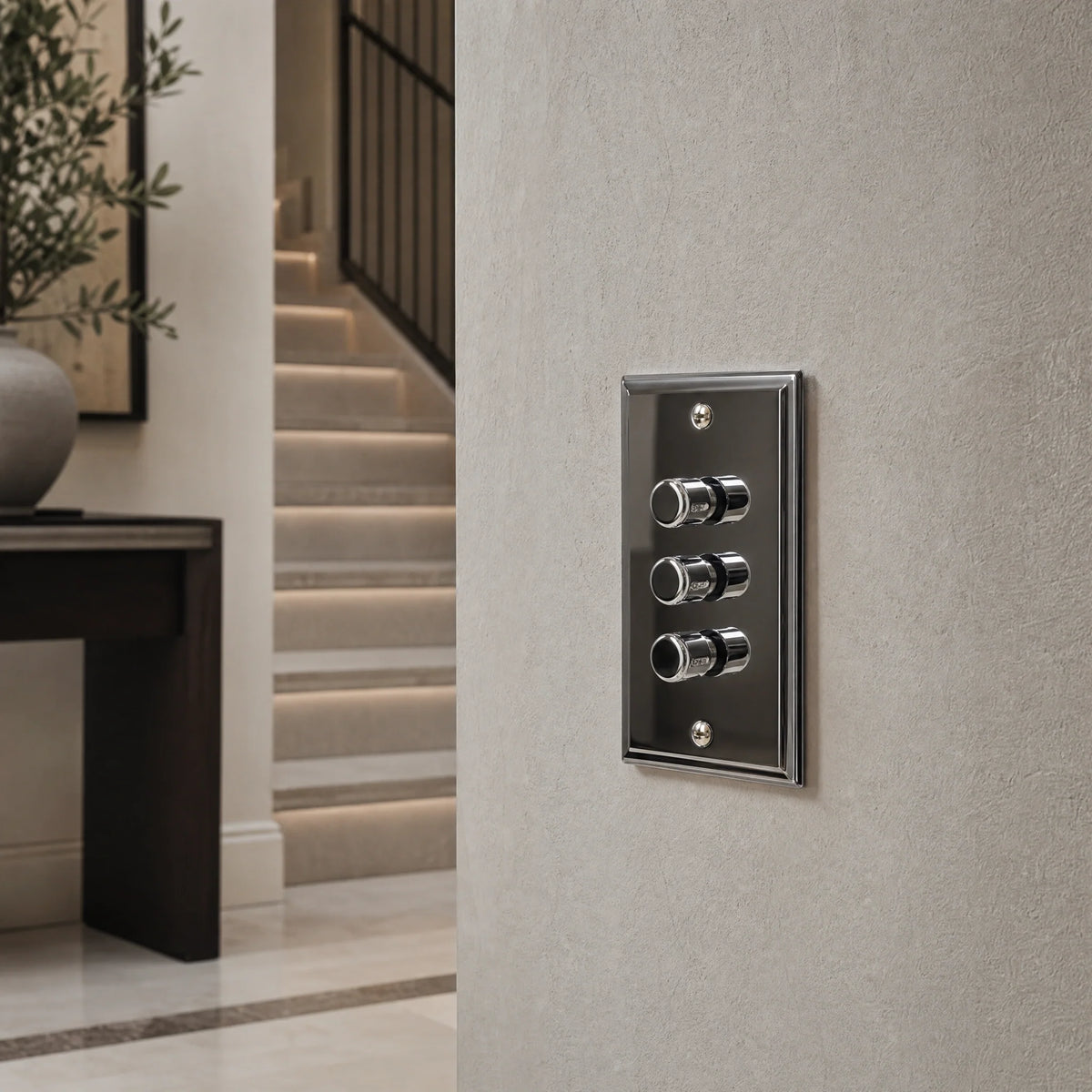 VORELLI® Sheraton three-gang dimmer switch, close view on an interior wall in an interior visualisation.