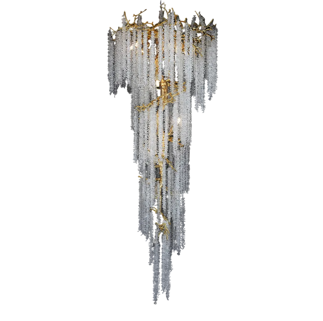 Wisteria spiral staircase chandelier with cascading crystal strands and sculptural gold branch design by VORELLI®